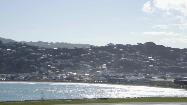 A Cesna 172N airplane from the Wellington Aero Club taking off from Wellington airport in NZ.