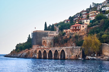 Naklejka premium view from the sea to the ancient shipyard and the old town. Alanya, Turkey.