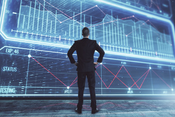 Obraz premium Businessman standing with business theme hologram. Multi exposure. Concept of analysis