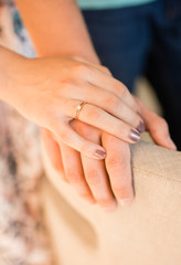 wearing a ring at a wedding. wedding ring on hand