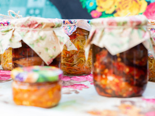  Canned vegetables in jars stand on the table