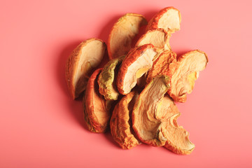 dried apples on a pink background