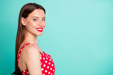 Close up photo of lovely lady looking smiling wearing polka-dot outfit isolated over teal turquoise background
