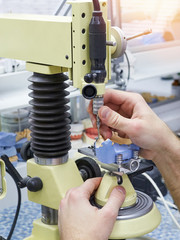 A technician in a dental laboratory works