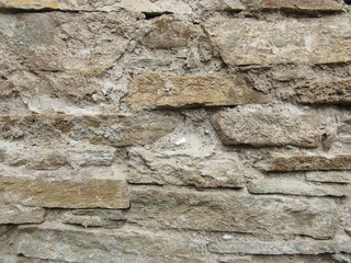 A fragment of an old ruined stone wall.