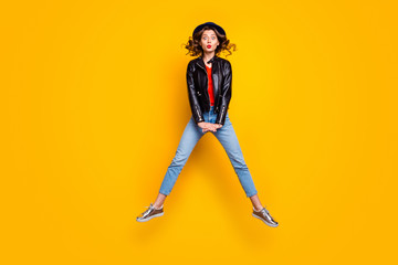 Full size photo of comic humor girl jump enjoy free time holiday wear denim jeans isolated over yellow color background