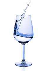 Water splash in wine glass isolated over white