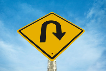 u-turn traffic  sign  with blue sky background