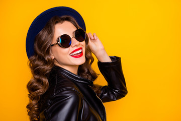 Close up photo of lovely cheerful girl have fun spring holiday laugh wear black look modern outfit isolated over yellow color background