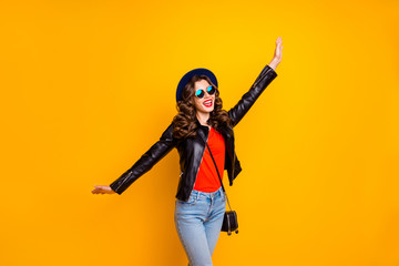 Photo of careless lady dancing on street overjoyed by spring warm weather wear stylish outfit isolated yellow color background