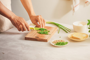 Wrapping Wonton and raw ingredients isolated at kitchen