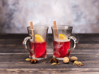 Christmas Mulled wine with spices on wooden background