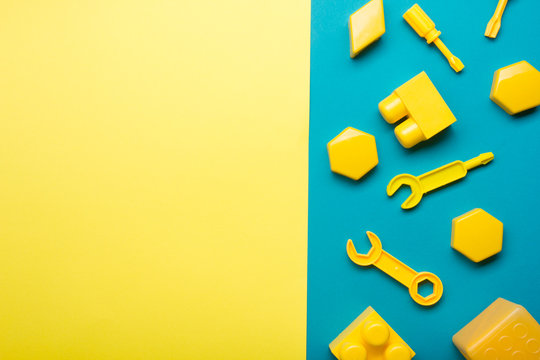 Kids educational developing toys frame on white background. Top view. Flat lay. Copy space for text