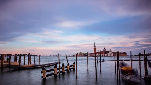 Time Lapse - Gondolas moored by Saint Mark square with San Giorgio di Maggiore church in Venice, Italy