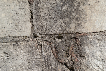The texture of the old concrete wall. Raw plaster wall background. The wall is made of natural stone shell rock.
