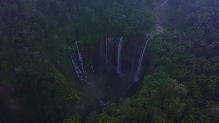 Aerial : Fly cam open view to Tumpak Sewu waterfall , Java island, Indonesia