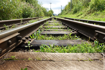 Old abandoned railway among the grass. Russia