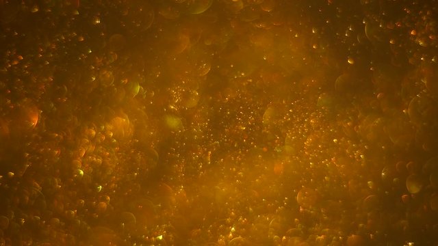 Abstract gold background with chaotical motion of bubbles, spinning, circling randomly. Balls rotation, abstract molecular brownian motion.