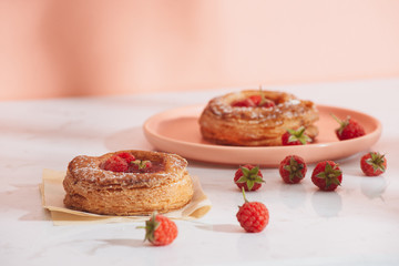 Homemade puff pastry with raspberries. Sweet tasty dessert. decorated with powdered sugar