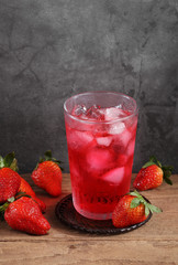 strawberry cocktail and strawberry on wooden table with a blank space for a text, Fruit in kitchen background