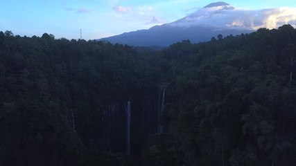 Aerial: Fly cam open view to  Semeru volcano and Tumpak Sewu waterfall , Java island, Indonesia