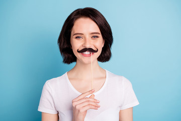 Close-up portrait of her she nice attractive lovely winsome cheerful cheery funky girl showing fake mustache isolated on bright vivid shine vibrant blue turquoise color background