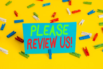Writing note showing Please Review Us. Business concept for situation or system is formal examination by showing authority Colored clothespin papers empty reminder yellow floor background office