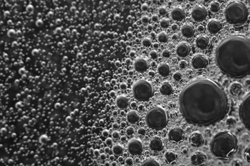 Bubbles of oxygen or air in a dark liquid. For projects with liquid or oil. Macro