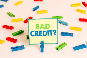 Conceptual hand writing showing Bad Creditquestion. Concept meaning inabilityof a demonstrating to repay a debt on time and in full Colored clothespin papers empty reminder white floor office