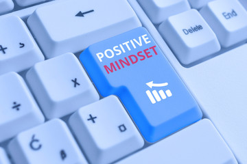 Conceptual hand writing showing Positive Mindset. Concept meaning mental attitude in wich you expect favorable results White pc keyboard with note paper above the white background