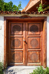Fototapeta na wymiar Traditional wooden door of a house