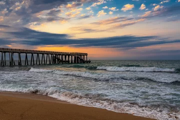 Poster de jardin  Pier at sunset, wavy beautiful sea  © Vastram