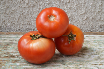 organic tomatoes on wooden background