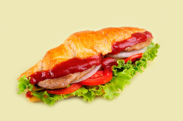 fresh sandwich close up with vegetables and meat fish isolated on yellow background