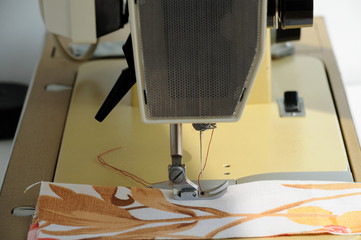 the sewing machine is prepared for the process of sewing clothes