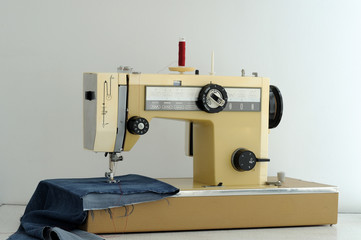 the sewing machine is prepared for the process of sewing clothes