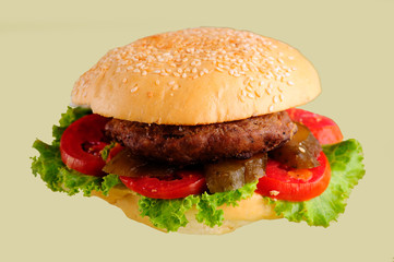 fresh tasty burger isolated on yellow background