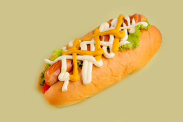 hot dogs with mustard for lunch on yellow background