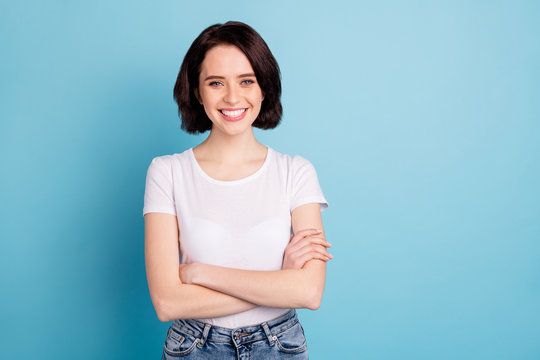 Portrait of her she nice attractive lovely charming content cute cheerful cheery girl enjoying folded arms isolated over bright vivid shine vibrant blue turquoise color background
