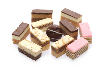 Traditional sweet pastries, cakes pile isolated on white background