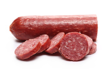 Fermented semi-dry, smoked sausage salami slices isolated on white background