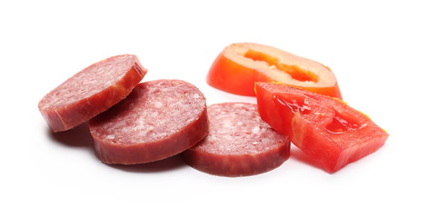 Fermented semi-dry, smoked sausage salami with tomato slice, isolated on white background