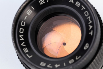 Vintage camera lens  isolated on white background .The diaphragm of a camera lens aperture - Image