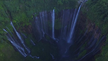 Aerial : Fly cam open view to Tumpak Sewu waterfall , Java island, Indonesia