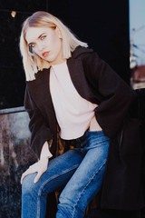 Fototapeta na wymiar portrait of a blonde girl in a coat