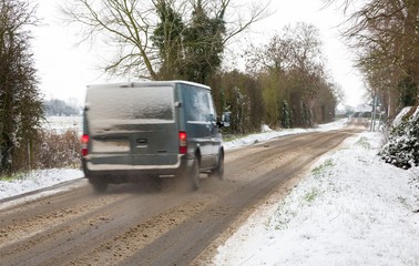 Transit van driving in snow