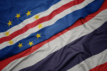 waving colorful flag of thailand and national flag of cape verde.