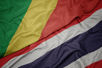 waving colorful flag of thailand and national flag of republic of the congo.