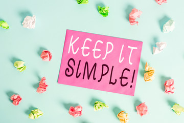 Fototapeta na wymiar Writing note showing Keep It Simple. Business concept for ask something easy understand not go into too much detail Colored crumpled rectangle shaped reminder paper light blue background