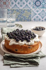 Fresh cakes with blackberries and cream cheese